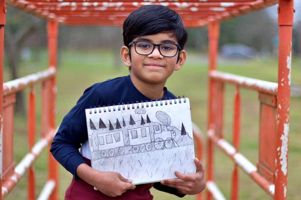 Eric posing with his pencil sketch project at Nimmy's Art, Katy, Texas.