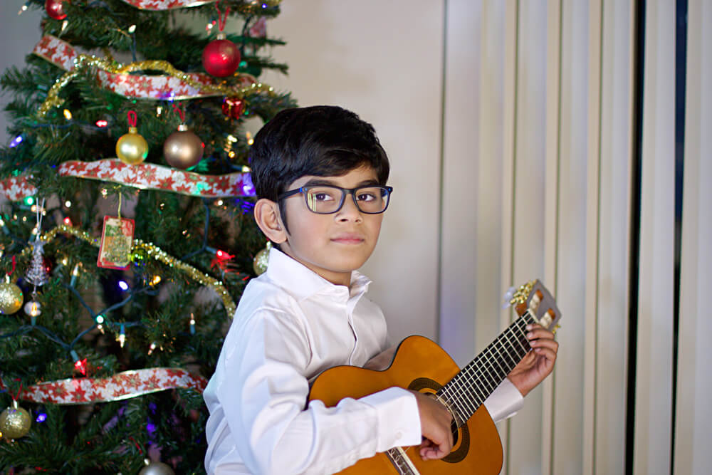 Eric playing the guitar. It's one of his passions other than art