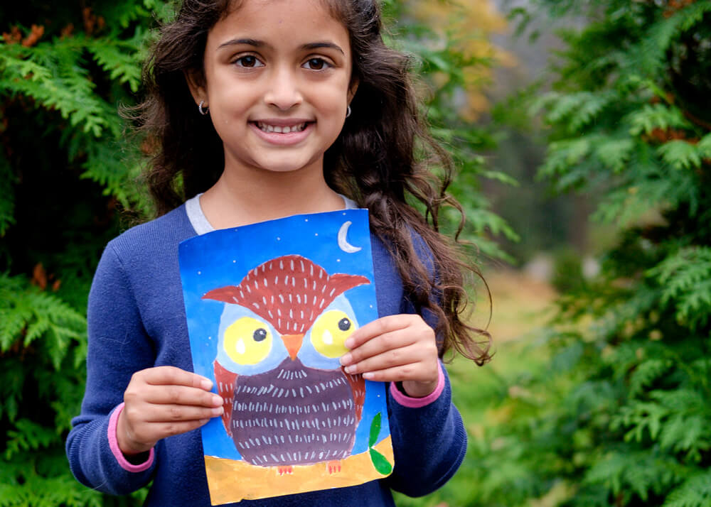 Anika with her artwork 'The Night Owl' in acrylic painting completed at Nimmy's Art online art classes for kids at Katy, Texas.