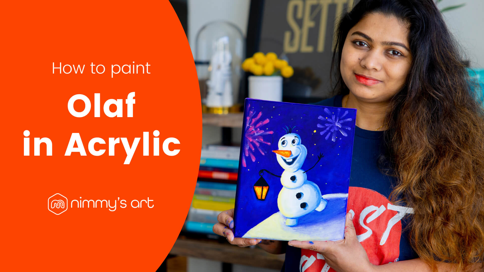 Nimmy holding the Olaf painting in acrylic done at our free art class in January 2021