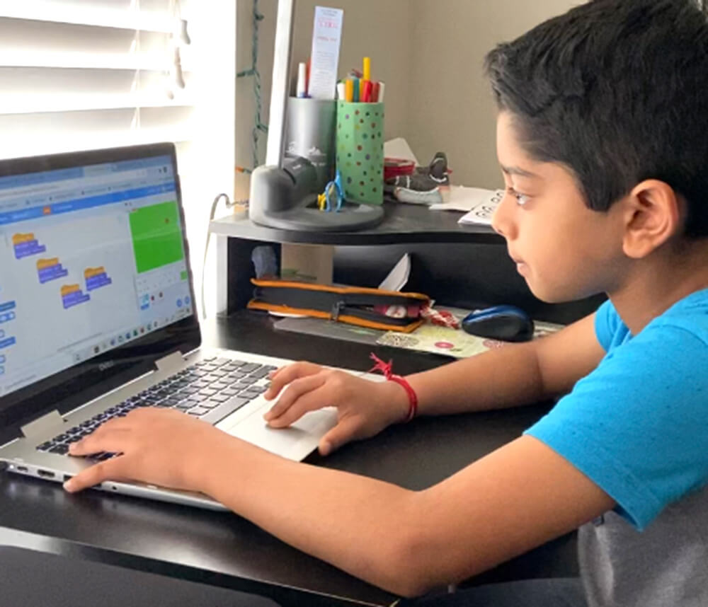 Coding passion - Aditya creating programs in Python and Scratch