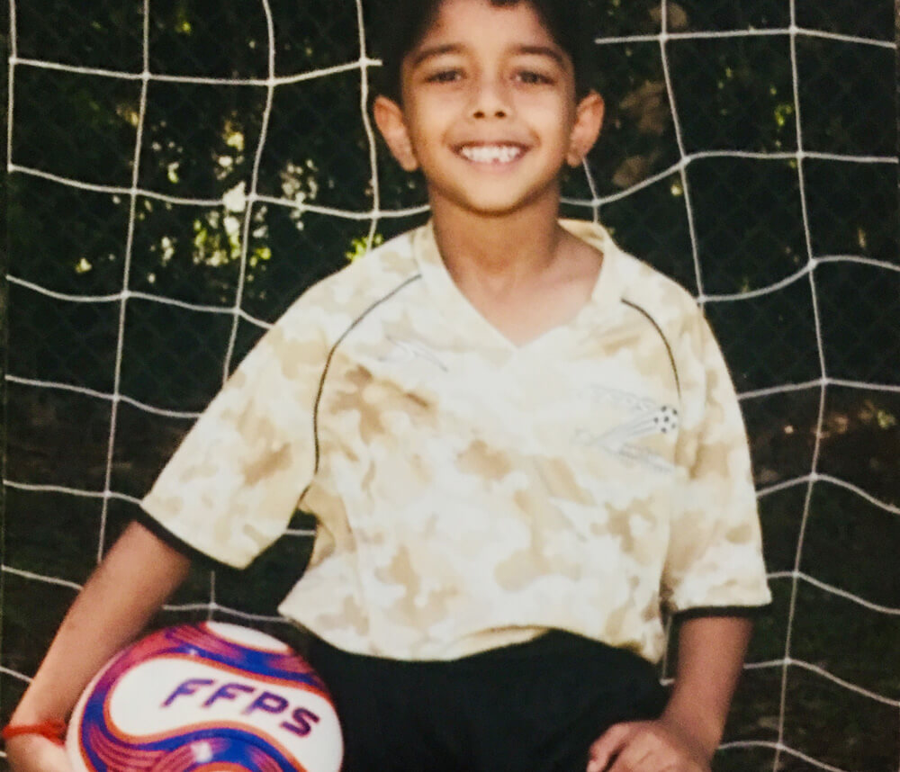 Aditya holding the soccer ball