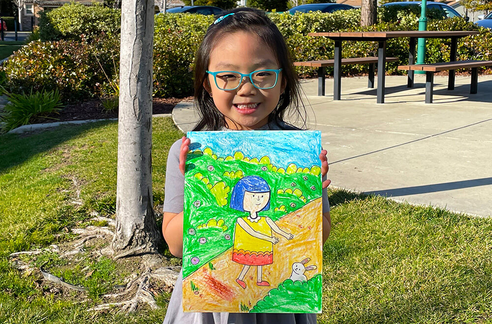 A girl with a bunny in oil pastels by Zoe at the online art classes by Nimmy's Art located at Katy, Texas