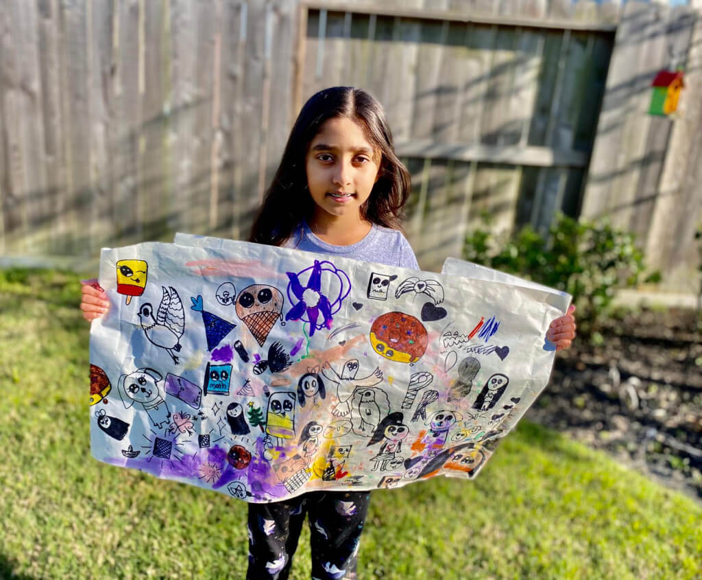 Prisha with her artwork