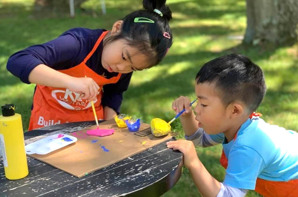 Rock painting with her brother