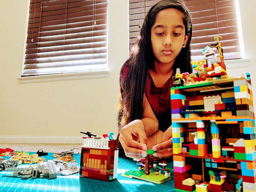 Mithra who attends our love online lessons for kids in Katy, Texas, loves to play with legos