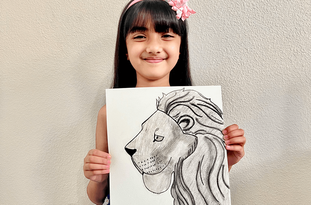 The mightly lion in charcoal medium by Ria, completed at teh online art classes for kids by Nimmy