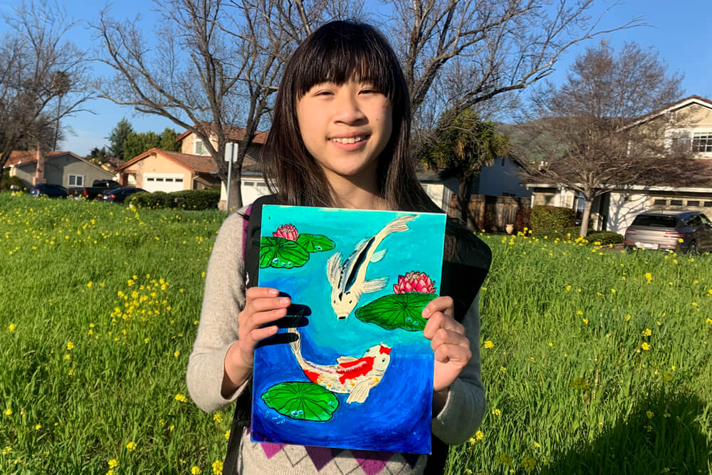 Picture of Nimmy's Art's young artist showcasing painting of a serene koi fish pond