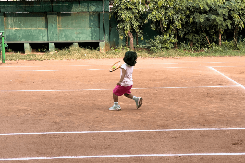 Talented young artist showcasing passion and skill on the tennis court, capturing the essence of athleticism and dedication