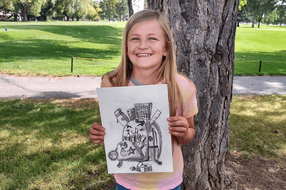 Charcoal drawing of a backpack filled with school supplies created by Olivia in Nimmy's Online Art Class.